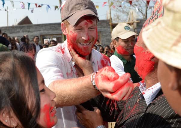 Prince Harry enjoying Holi, the Hindu Festival of Colour, on a trip to Nepal last year