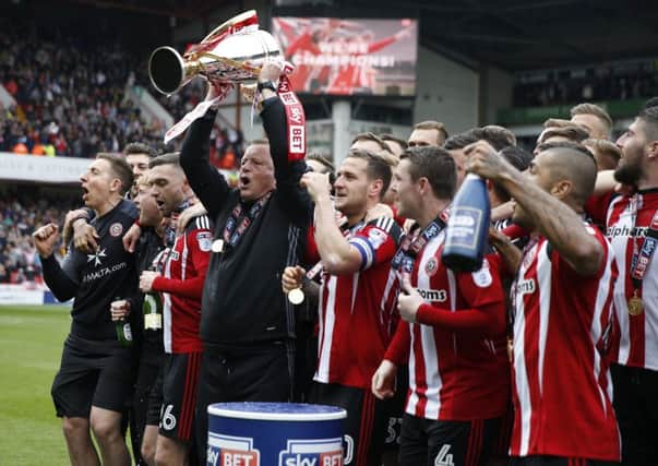 Chris Wilder manager of Sheffield United lifts the trophy during the English League One match at  Bramall Lane (Picture: Simon Bellis/Sportimage)