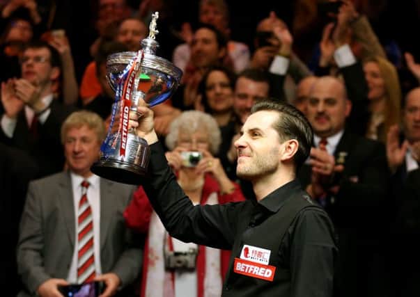 Mark Selby celebrates winning the world snooker title. (Picture: PA)