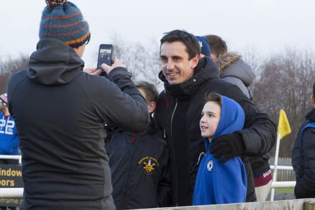 Gary Neville poses with young fans at Brighouse Town FC, during the visit from Salford City FC, who play FC Halifax Town in the National League North semi-final (Picture: Bruce Fitzgerald)