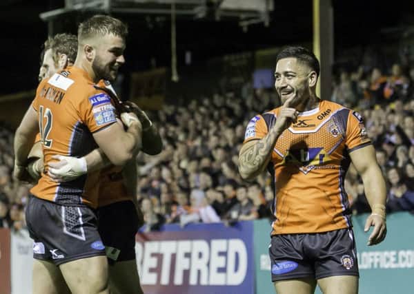 Rangis Chase celebrates with Castleford team-mates Joel Monaghan and Mike McMeeken (Picture: SWpix.com)