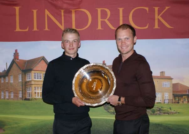 Fulford's Charlie Thornton receives the Danny Willett Salver from the man himself.