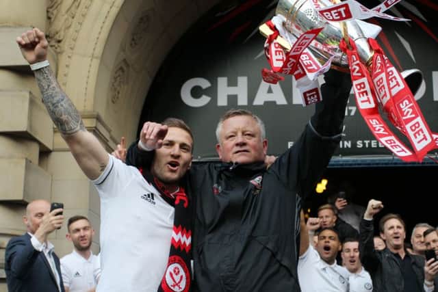 Sheffield United manager Chris Wilder and captain Billy Sharp with the League One trophy