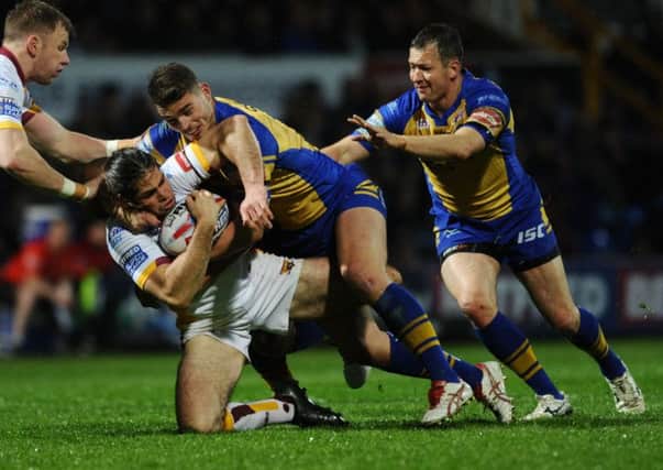 READY FOR ACTION: Huddersfield Giants' Jake Mamo comes under pressure from Leeds Rhinos' Stevie Ward during last week's encounter. Picture: Jonathan Gawthorpe