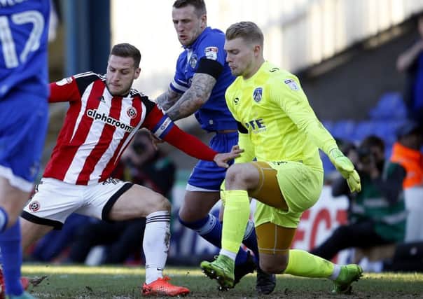 BRIGHT FUTURE: Connor Ripley, right, in action for Oldham against Sheffield United earlier this season. Picture: Simon Bellis/Sportimage