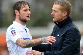 On his way back: Liam Cooper, left, is recalled by coach Garry Monk, right, after completing a six-game ban. (Picture: Jonathan Gawthorpe)
