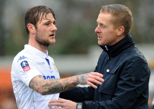 On his way back: Liam Cooper, left, is recalled by coach Garry Monk, right, after completing a six-game ban. (Picture: Jonathan Gawthorpe)