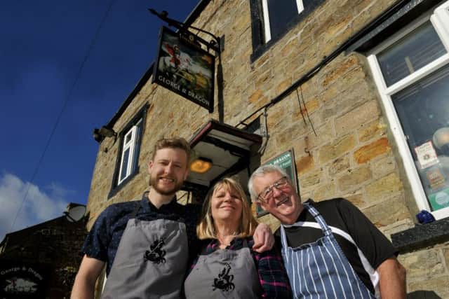 Stuart  Miller (left), the Landlord of the George and Dragon pub at Hudswell with his mum and dad, Keith and Stephanie Miller, who are also part of the team.