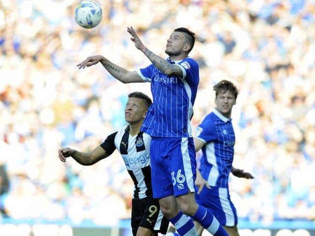 Sheffield Wednesday manager Daniel Pudil  challenges Newcastle's Dwight Gayle (Picture: Steve Ellis).