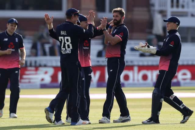England's Liam Plunkett is congratulated by teammates after taking the wicket of Ireland's Tim Murtagh at Lord's. Picture: John Walton/PA