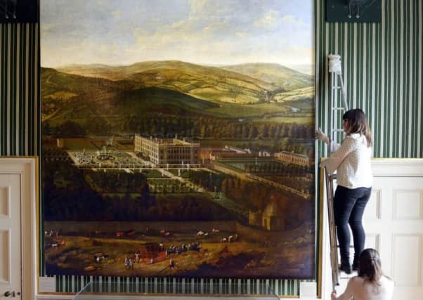 Chatsworth staff make final adjustments to ' A View of Chatsworth ' by Jan Siberechts, painted circa 1703 which has recently been added to The Devonshire Collection. Picture Scott Merrylees