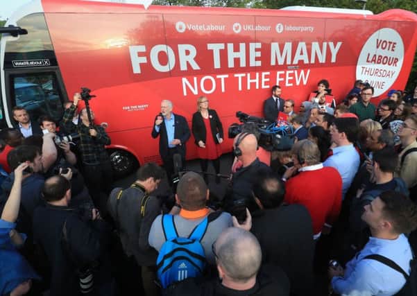 Labour leader Jeremy Corbyn with his party's campaign bus.