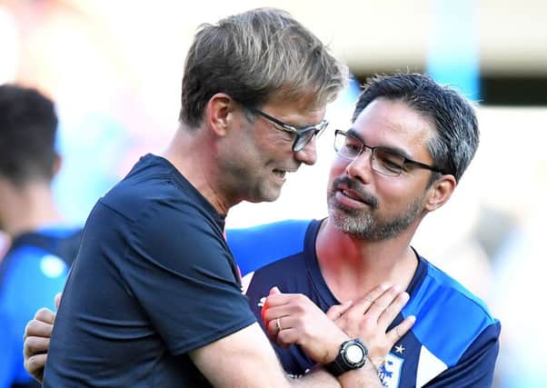 Liverpool manager Jurgen Klopp, left, with Huddersfield Town head coach David Wagner before last July's pre-season friendly at John Smith's Stadium (Picture: Dave Howarth/PA Wire).