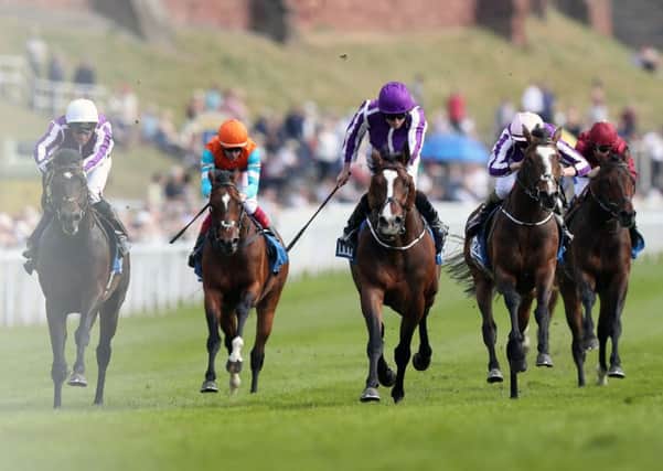 Venice Beach, centre, ridden by Ryan Moore, winning the MBNA Chester Vase Stakes yesterday (Picture: Simon Cooper/PA).
