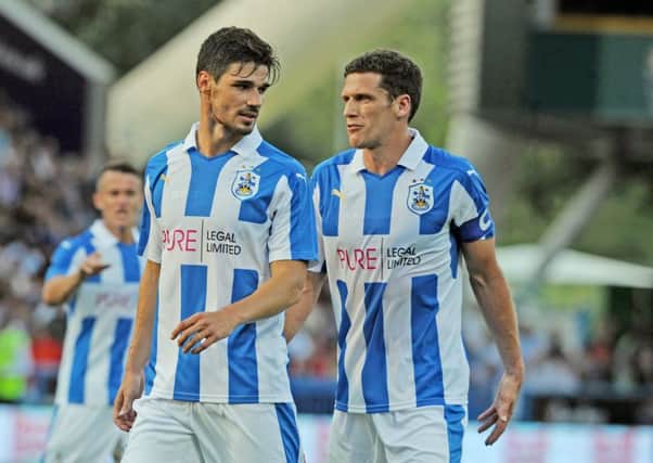 In it together: Christopher Schindler, left, with Mark Hudson, understands the pressures that come with a two-legged play-off encounter, more than most. (Picture: Tony Johnson)