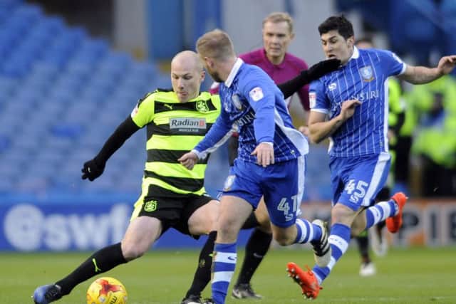 Huddersfield player Aaron Mooy is challenged by Barry Bannan in the  January 14th, 2017, fixture between the two. (Picture: Simon Hulme)