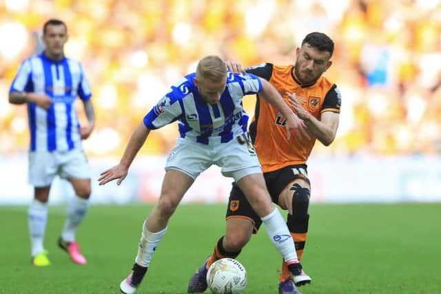 Sheffield Wednesday's Barry Bannan (left) and Hull City's Robert Snodgrass battle for the ball at Wembley last season. Picture: Nigel French/PA.