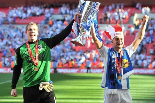 Huddersfield Town's Alex Smithies (left) and Jack Hunt celebrate promotion to the Championship after winning the League One Play-Off Final Final at Wembley in 2012. Picture: Martin Rickett/PA.