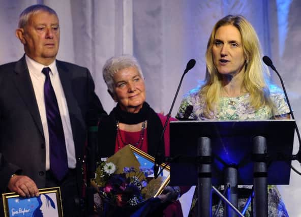 Kim Leadbeater, the sister of mudered MP Jo Cox, accepts the White Rose Award watched by her parents Jean and Gordon.
 
Picture Jonathan Gawthorpe