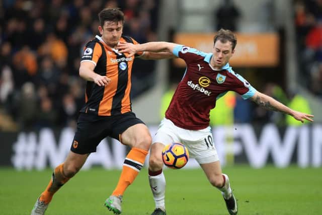 Hull City's Harry Maguire (left) and Burnley's Ashley Barnes battle for the ball during the Premier League match at the KCOM Stadium, Hull. (Picture: Mike Egerton/PA Wire)
