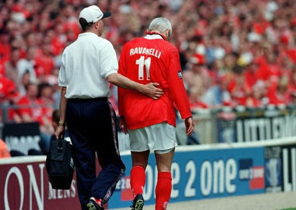 Middlesbrough's Italian striker Fabrizio Ravanelli is escorted off the pitch after sustaining an injury during the FA Cup final of 1997. (Picture: Reuters)