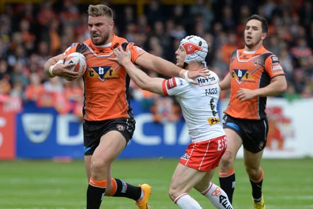 Mike McMeeken pushes off Theo Fages.
Castleford v St Helens.  Labrokes Challenge Cup.  Mend-a-Hose Jungle. 12 May 2017.  Picture Bruce Rollinson