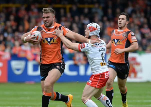 Mike McMeeken pushes off Theo Fages.
Castleford v St Helens.  Labrokes Challenge Cup.  Mend-a-Hose Jungle. 12 May 2017.  Picture Bruce Rollinson
