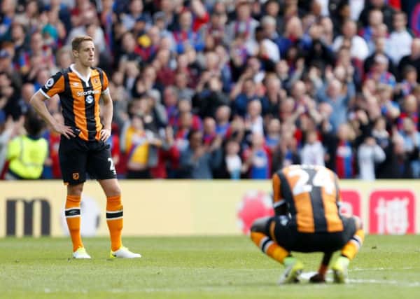 Hull City's Michael Dawson (left) looks dejected after relegation. Picture: Paul Harding/PA.