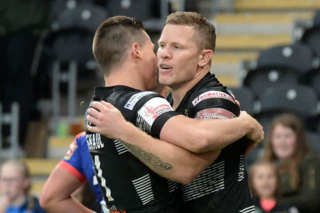 Steve Michaels celebrates his opening try with Jamie Shaul. (Picture: Bruce Rollinson)
