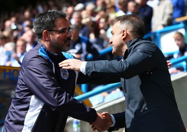 SEE YOU ON WEDNESDAY: Huddersfield Town manager David Wagner (left) and Sheffield Wednesday manager Carlos Carvalhal shake hands prior to kick off on Sunday. Picture: Dave Thompson/PA