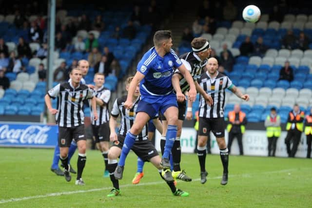 THAT MOMENT: Halifax Town's Scott Garner flicks his header to score the winner in extra-time. Picture: Tony Johnson.