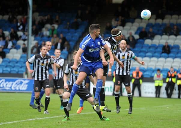 THAT MOMENT: Halifax Town's Scott Garner flicks his header to score the winner in extra-time. Picture: Tony Johnson.