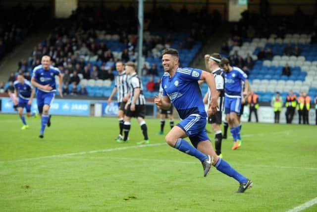 NEARLY THERE: FC Halifax Town's Scott Garner celebrates after he scoring what proved to be the winner in extra-time. Picture: Tony Johnson.