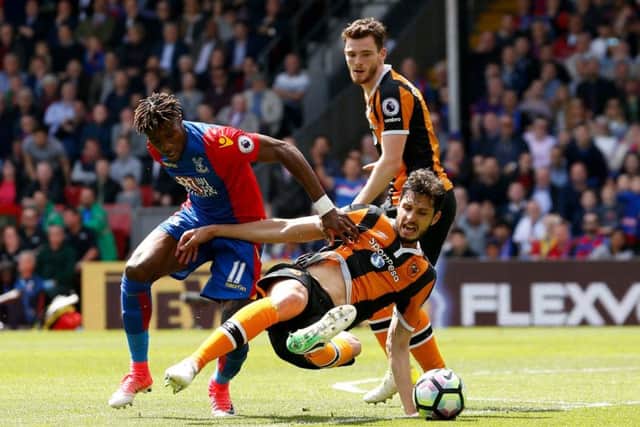 Crystal Palace's Wilfried Zaha (left) and Hull City's Andrea Ranocchia battle for the ball during the Premier League match at Selhurst Park, London. (Picture: Paul Harding/PA Wire)