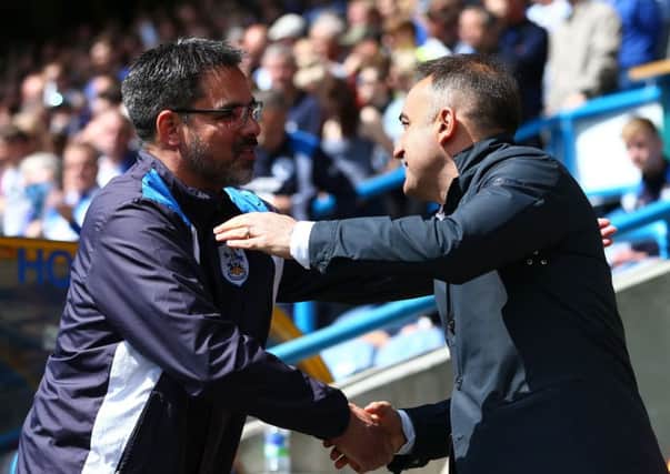 Huddersfield Town head coach David Wagner and his Sheffield Wednesday counterpart Carlos Carvalhal shake hands prior to kick-off yesterday at John Smith's Stadium (Picture: Dave Thompson/PA Wire).