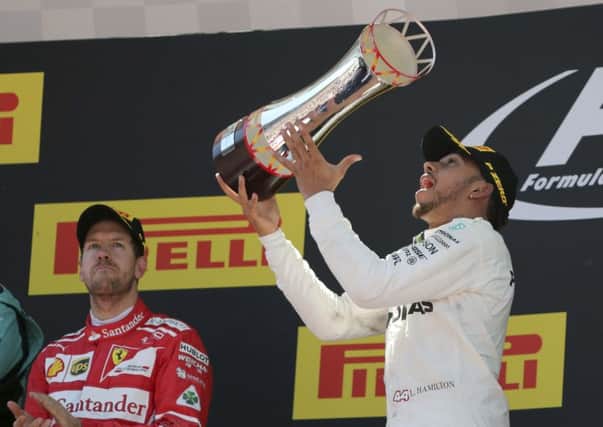 Mercedes driver Lewis Hamilton celebrates.