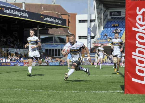 Rob Burow runs in a second try for Leeds.
