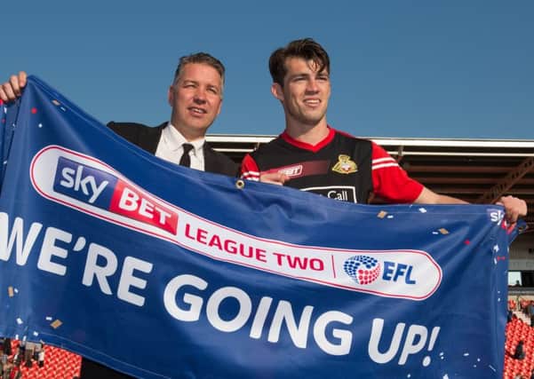 Doncaster Rovers manager Darren Ferguson celebrates promotion with John Marquis after the Sky Bet League Two match against Mansfield at the Keepmoat Stadium