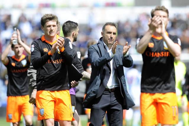 Owls boss Carlos Carvalhal joins the Wednesday players in saluting the travelling support at Huddersfield on Sunday. (Picture: Steve Ellis)