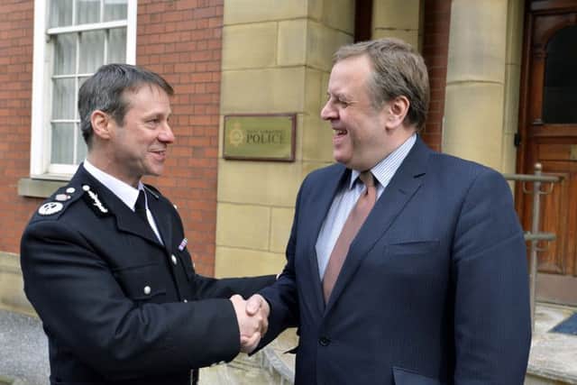 The new chief constable of West Yorkshire police, Mark Gilmore, is pictured at the force's headquarters in Wakefield on his first day in charge. Mr. Gilmore is pictured with West Yorkshire PCC, Mark Burns-Williamson.
picture mike cowling april 2 2013
