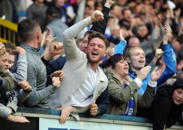 JUST GRAND: FC Halifax Town fans show their delight during Saturday's National League North play-off final victory at The Shay. Picture: Tony Johnson.