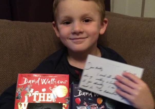 Paddy with his gifts from David Walliams