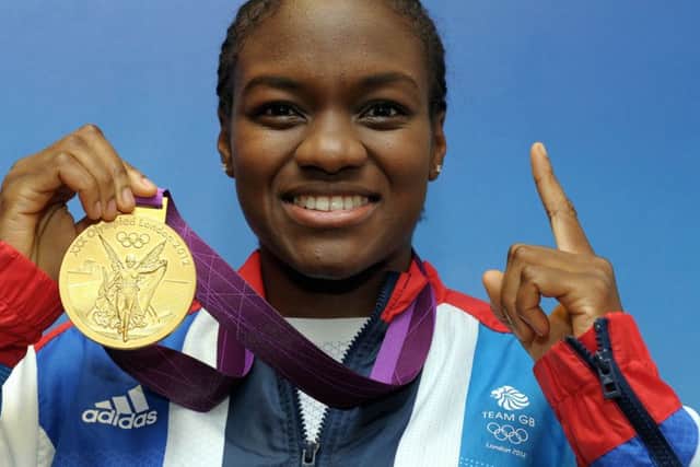 All smiles after winning the gold medal at the 2012 London Olympics. (PA).