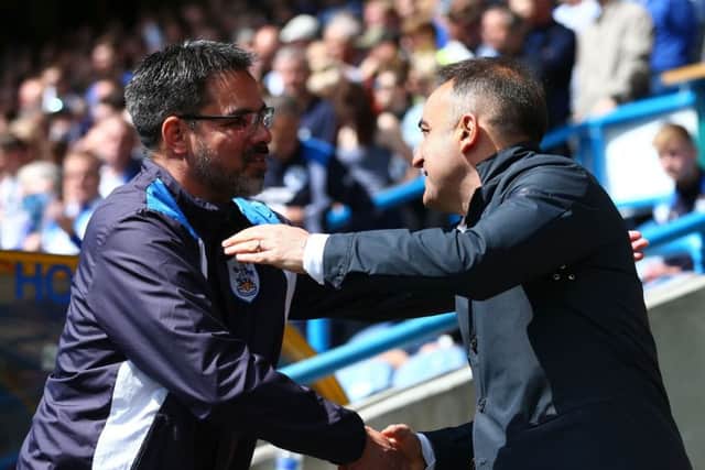 Huddersfield Town manager David Wagner (left) and Sheffield Wednesday manager Carlos Carvalhal shake hands prior to kick off on Sunday. Picture: Dave Thompson/PA