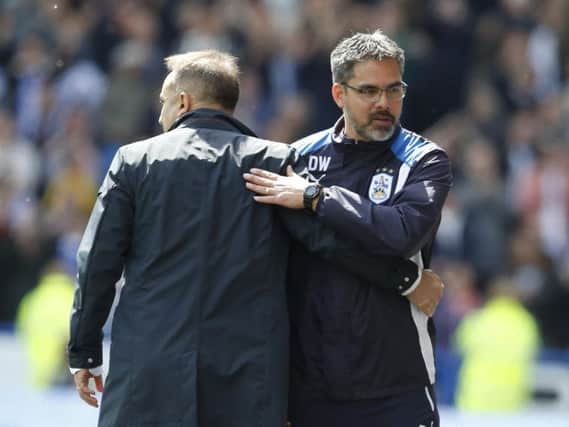Sheffield Wednesday boss Carlos Carvalhal and Huddersfield Town's David Wagner embrace after Sunday's goalless draw.
