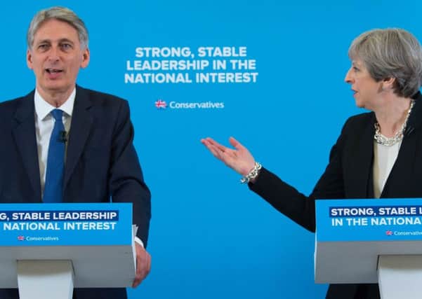 Theresa May and Philip Hammond campaigning together today