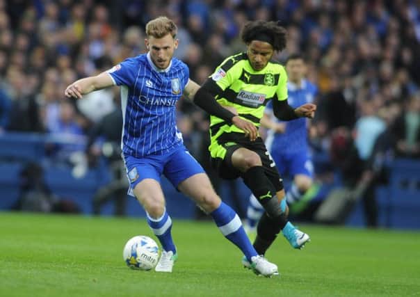 Huddersfield Town's Izzy Brown closes on Sheffield Wednesday's Tom Lees. Picture: Tony Johnson.