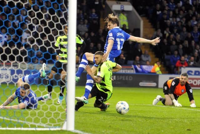 17 May 2017.......    Sheffield Wednesday v Huddersfield Town's Nahki Wells pressures Sheffield Wednesday's into scoring an own goal for the visitors' equaliser. Picture: Tony Johnson.