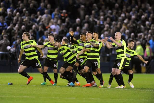 LET'S GET THIS PARTY STARTED: Huddersfield Town's players begin to celebrate after winning a dramatic penalty shootout. Picture: Tony Johnson.