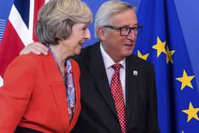 Theresa May with European Commission president Jean-Claude Juncker.